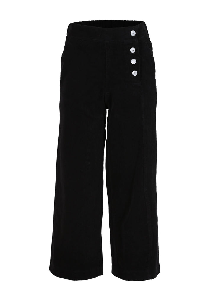Our Betsy style features unique button detailing on the side to give our classic Peggy cords a twist. The cord gives the style a more tactile appearance and adds an architectural element with the texture and heavier drape. Super comfortable with moderate stretch and an elasticised back. Black colour. Front view.
