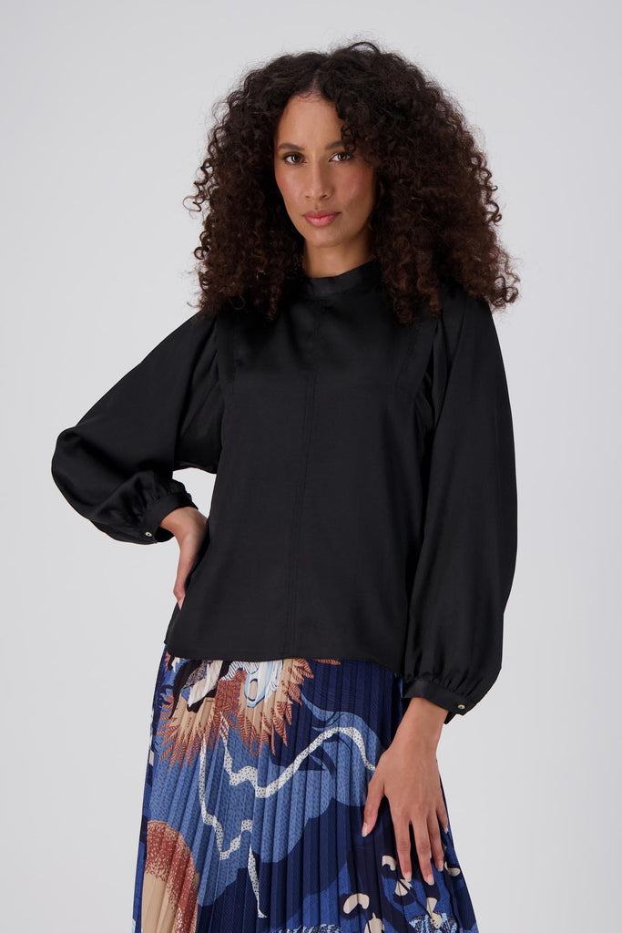 Olga de Polga Moonshine blouse in Black soft, satin viscose. Front view on model.