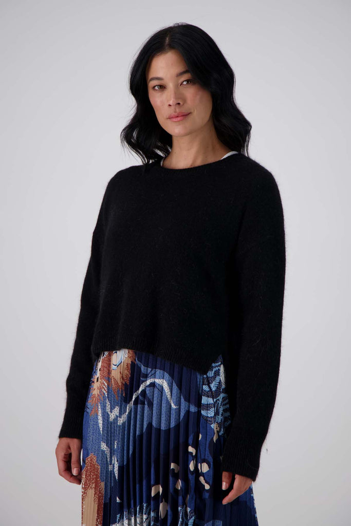 Olga de Polga Black Portland sweater in an angora and wool fabrication. Slightly cropped length with long sleeves and a round neck. Front view