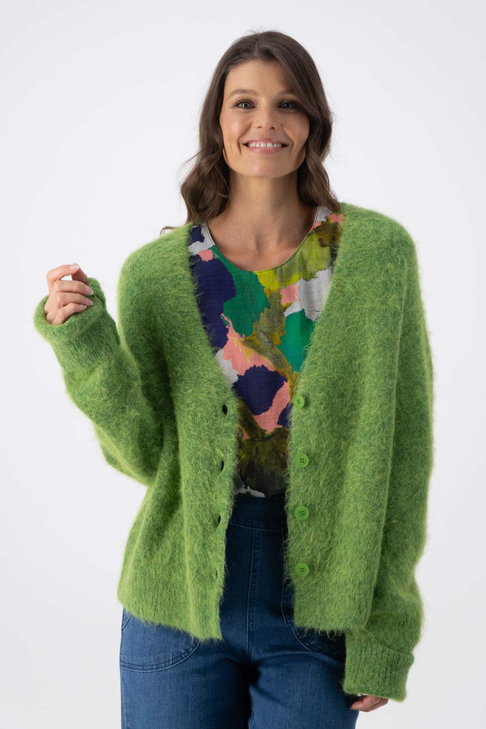 Olga de Polga Green alpaca In Transit short cardigan. With a button front and long sleeves. Front view