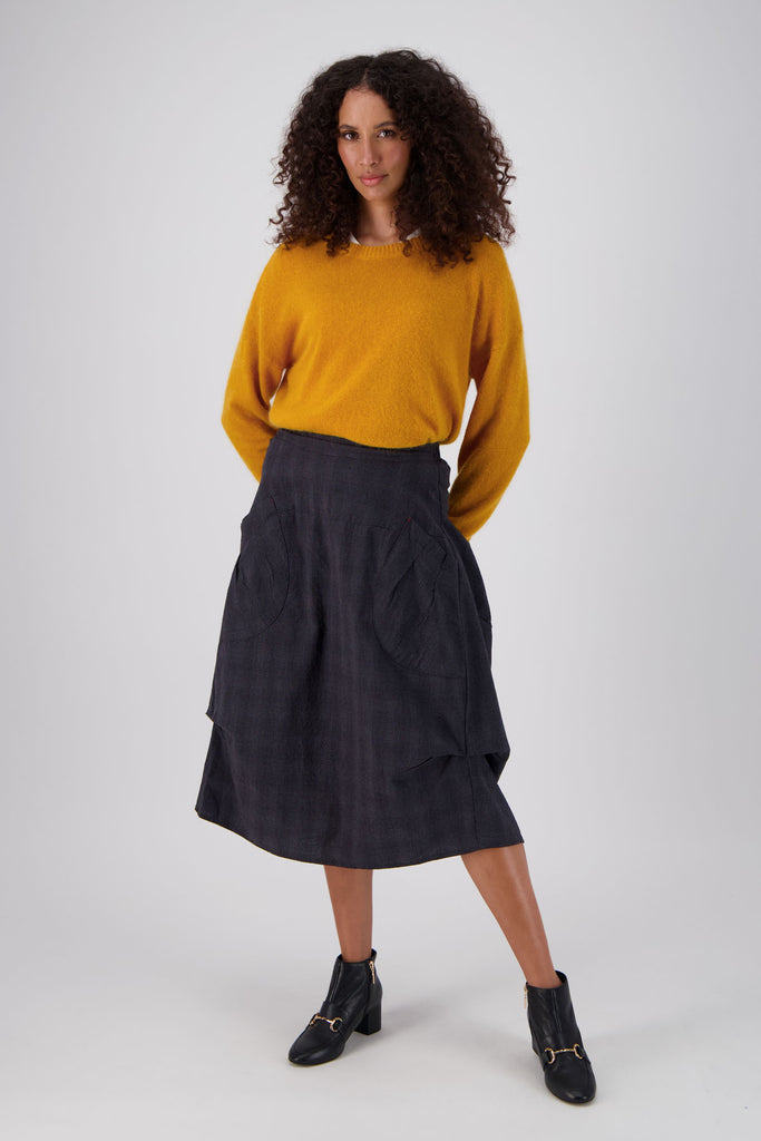 Olga de Polga favourite the Milwaukee skirt in charcoal textured cotton. 100% cotton. Cut in a universally-flattering a-line design, the pockets and subtle gathers on this skirt create a unique shape.  Front full length view