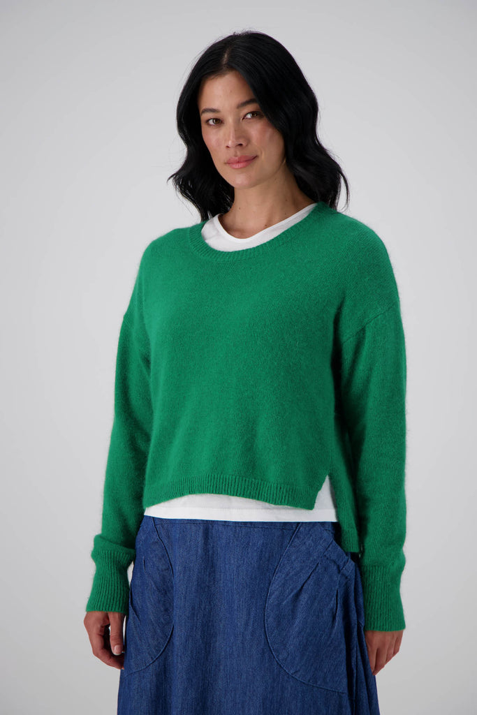 Olga de Polga's Portland sweater in Emerald green is made from a soft angora/wool mix.With a round neckline and a slightly cropped length, with long sleeves. Front view