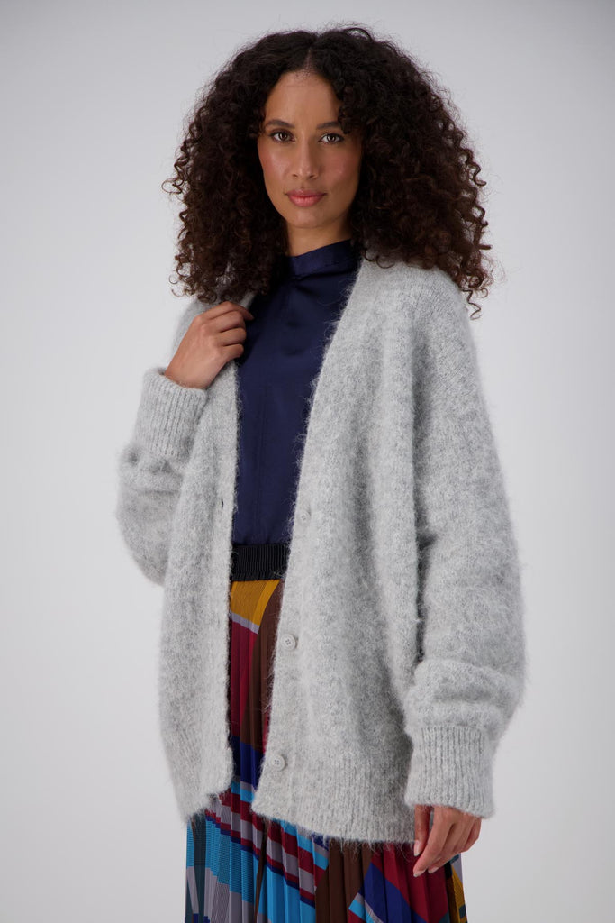 Olga de Polga long, cosy alpaca To the Moon and Back cardigan, with a button front and extra long sleeves. Side front