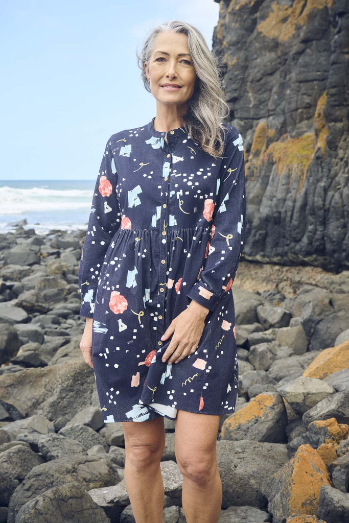 Olga de Polga navy Galaxy printed cotton cord tunic dress. Perfect transeasonal dress with long sleeves and a round neckline. Front view on model.