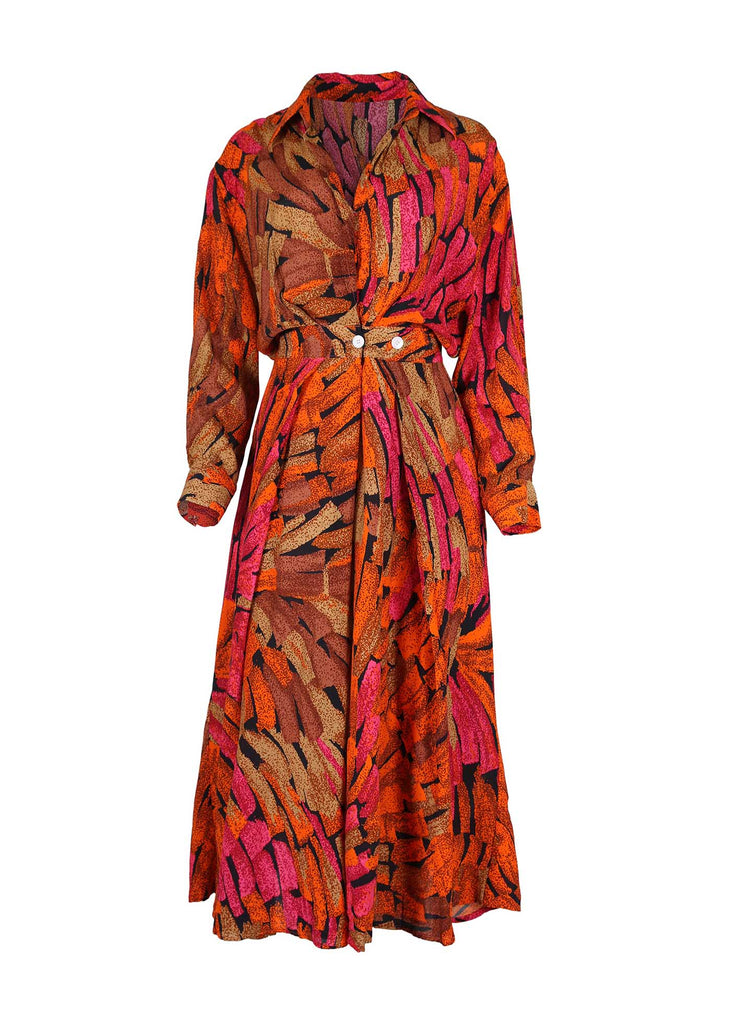 Olga de Polga Parisian Wrap-dress in Orange Vivant printed Viscose. This is a midi dress with long sleeves and a collar. Button detailing at the waist. Front view 