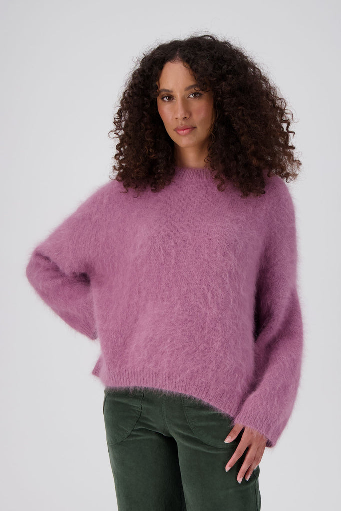 Olga de Polga's angora knit jumper in blush pink. Relaxed, boxy fit that drapes with ease with a dropped shoulder. Front view on model.