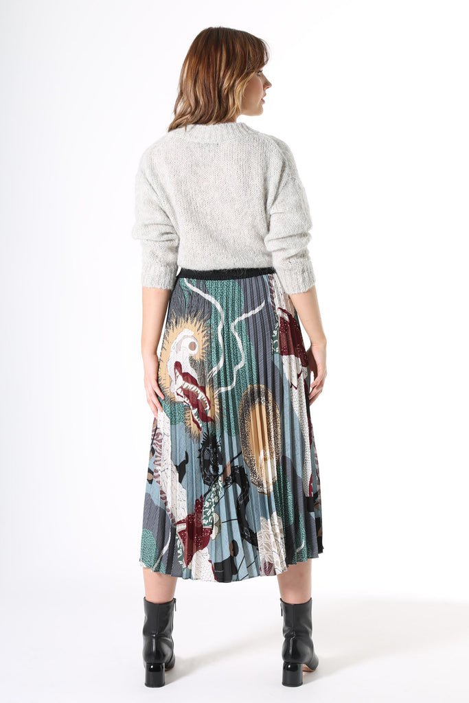 Olga de Polga pleated skirt in Green Festival printed recycled polyester.  Back view on model