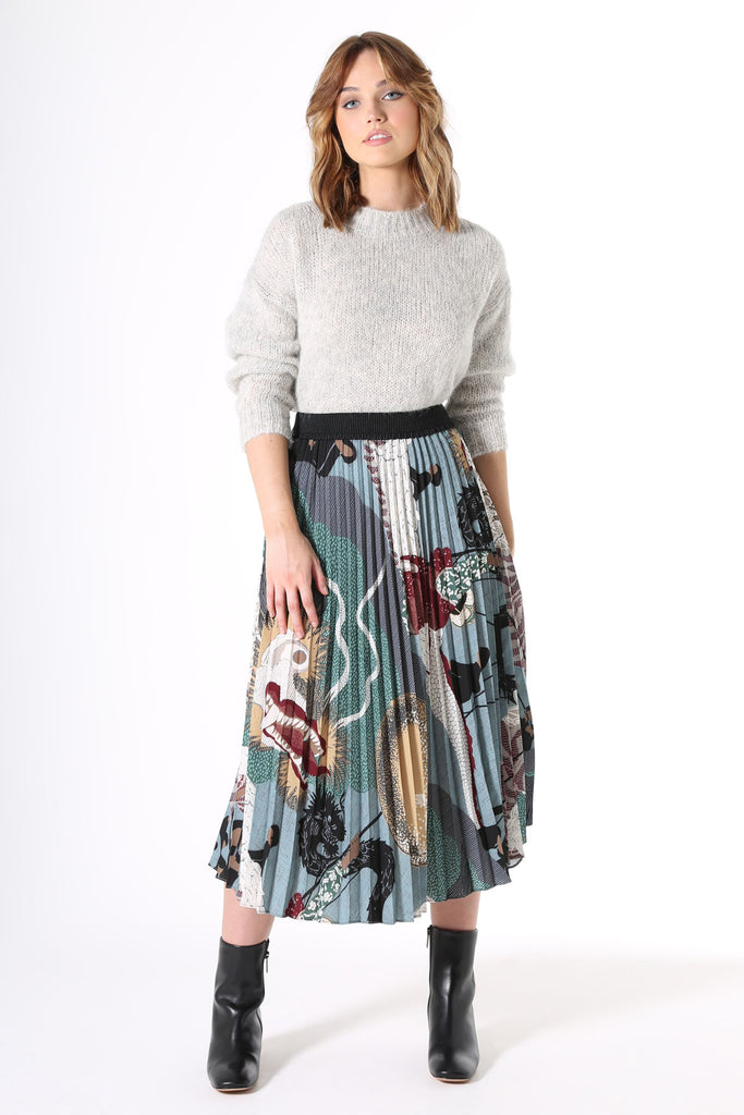 Olga de Polga pleated skirt in Green Festival printed recycled polyester. Front view on model