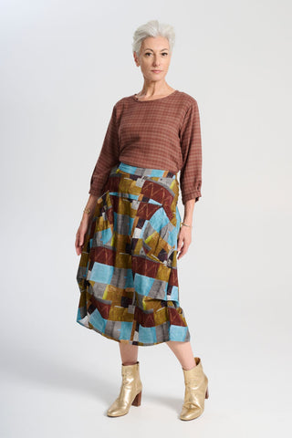 Olga de Polga blue Azure Kismet printed Milwaukee skirt in fine cord. Our best selling incredibly unique, chic and original skirt. It is universally flattering, highly versatile, and super comfortable. Perfect to throw on and go. Front view on model