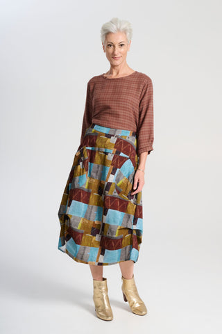 Olga de Polga blue Azure Kismet printed Milwaukee skirt in fine cord. Our best selling incredibly unique, chic and original skirt. It is universally flattering, highly versatile, and super comfortable. Perfect to throw on and go.  Front full view on model