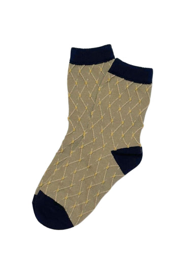 Olga de Polga Crinkle Diamond socks in beige and navy with small mustard dots.