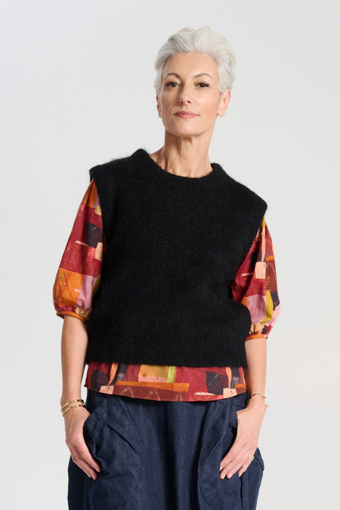 Olga de Polga Black Aspen Vest. A beautifully textured knit vest—your perfect layering essential for effortless, trans-seasonal styling.  Front view on model