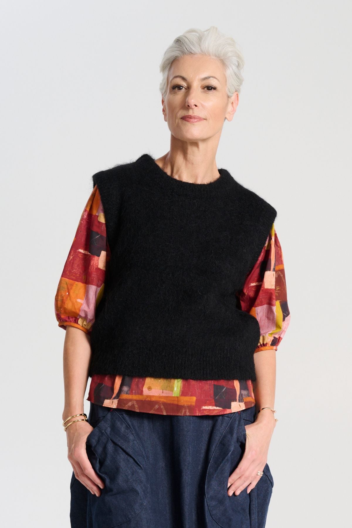 Olga de Polga Black Aspen Vest. A beautifully textured knit vest—your perfect layering essential for effortless, trans-seasonal styling.  Front view on model