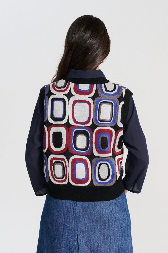 Olga de Polga Black Knitted vest - the Cool Bristol Knit Vest. Back close view on model.