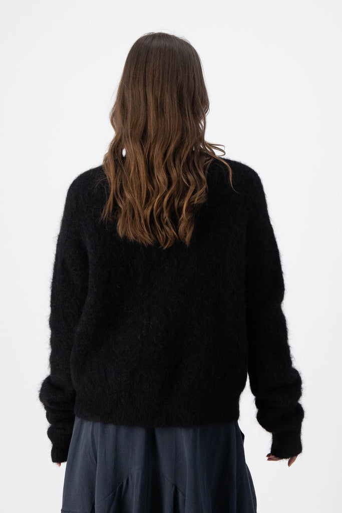 Olga de Polga Black alpaca In Transit short cardigan. Back view