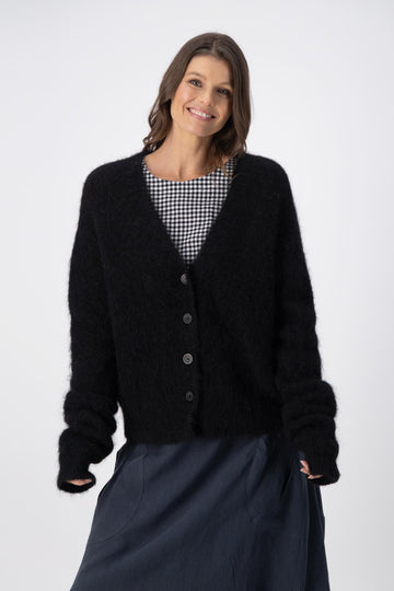 Olga de Polga Black alpaca In Transit short cardigan. Front view 