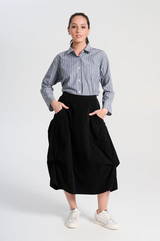 Olga de Polga striped Indra shirt in Licorice. The signature Olga Shirt is great for all occasions. It has an effortlessly chic, relaxed silhouette that drapes with ease. Leave it loose or tuck it in - the choice is yours. Front view with shirt tucked in.