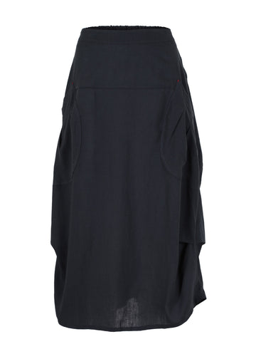 Black Luminary Milwaukee skirt in linen. Soft lightweight summer skirt. Unique A-line panelled design with a soft drape. Front view.