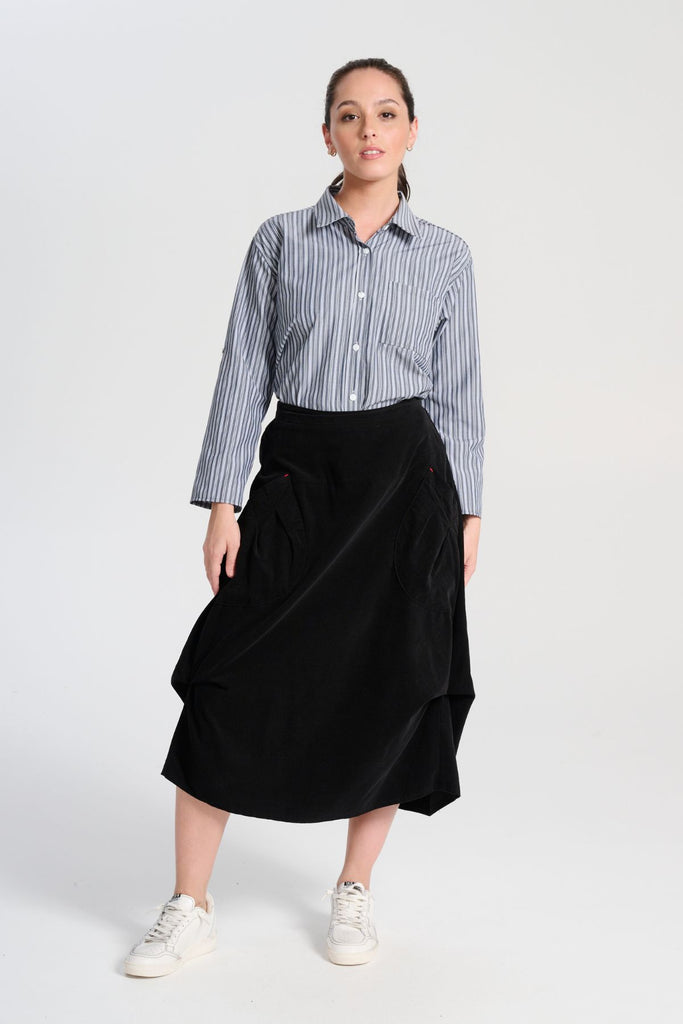 Olga de Polga Black Milwaukee Marlow skirt in fine cotton cord. Comfy waistband making it the perfect throw-on-and-go! Front view on model