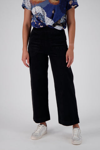 Olga de Polga's bet selling Peggy Pants in Black fine cotton cord.  Front close up on model