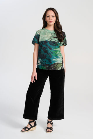 Olga de Polga Peggy Paris cropped wide leg pants in black soft velvet. Soft to the touch yet durable, the fabric drapes beautifully while maintaining its shape, making these pants ideal for cooler months. Full front view on model