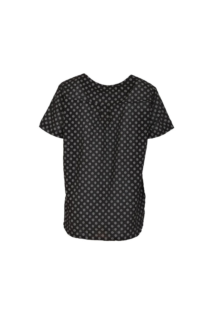 Olga de Polga Black Polka Dot Top with a round neckline and short sleeves. This top finishes at the hip. back view.