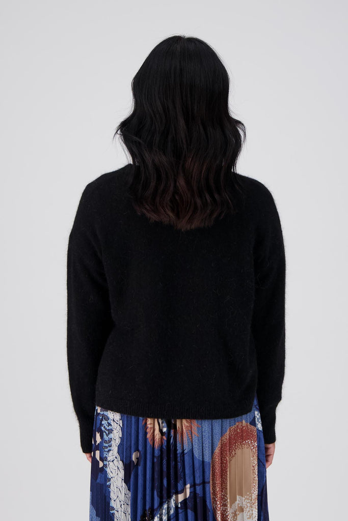 Olga de Polga Black Portland sweater in an angora and wool fabrication. Slightly cropped length with long sleeves and a round neck.  Back view