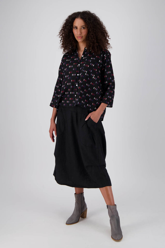 Olga de Polga Black Telegraph blouse in woven cotton with a collar and button up front. 3/4 sleeves and a trapeze shape. Front full length view on model