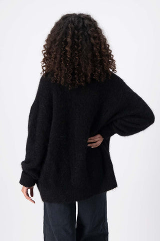 Olga de Polga Black To The Moon & Back alpaca long cardigan coat with extra long sleeves.  Back view