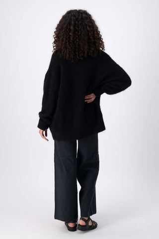 Olga de Polga Black To The Moon & Back alpaca long cardigan coat with extra long sleeves. Full back view 