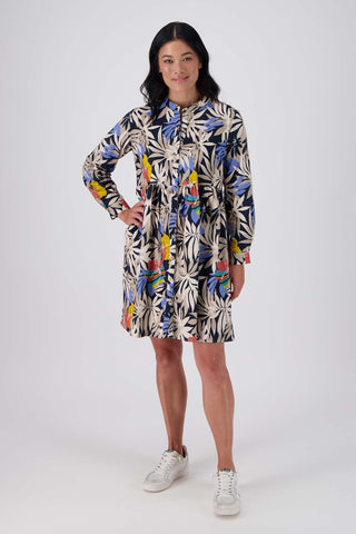 Olga de Polga tunic dress in Wildflowers printed cotton corduroy. Long sleeves with a cuff and a front button opening. Front full length view on model.