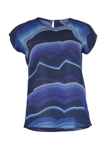 Olga de Polga classic tee in Blue Aurora printed cotton seersucker. With a round neckline and cap sleeves this tee finishes at the hip. Front view.