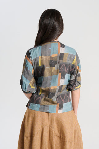 Olga de Polga Azure blue soft wash Camisa blouse in 100% Tencel. A reversible top with a soft v-neck on one side and a round neck on the other side. 
 Half sleeves, with a batwing shape. Back view on model
