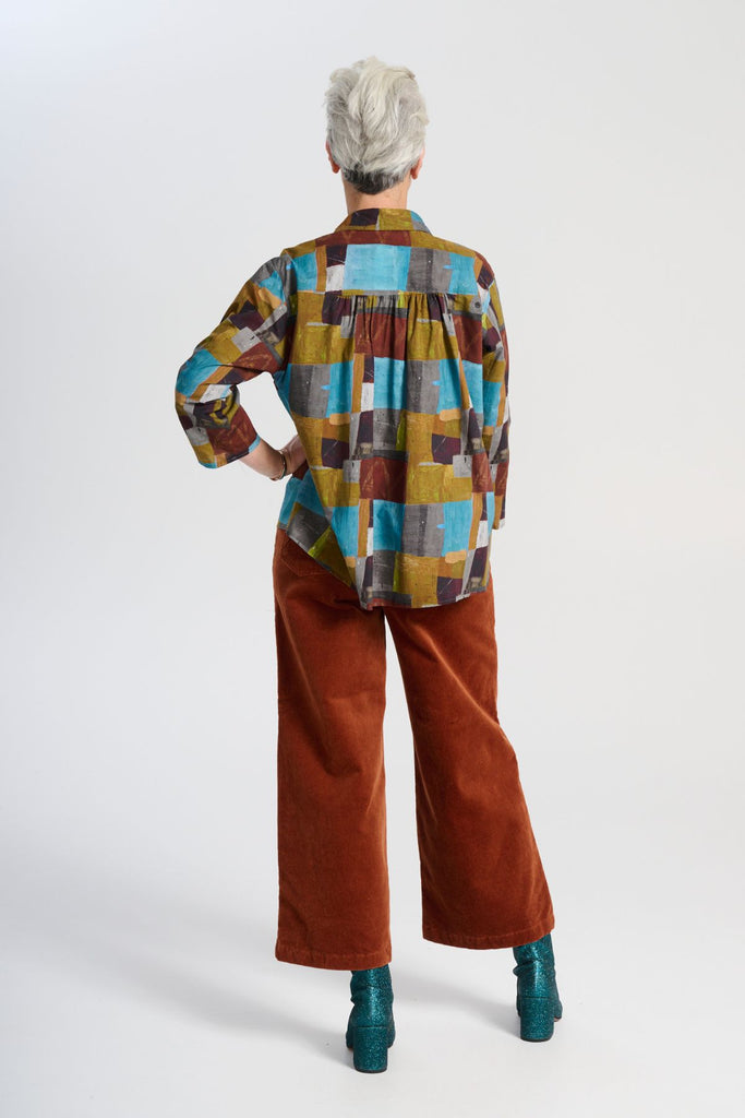 Olga de Polga classic cotton shirt in our AW25 Azure Kismet print from the Odyssey collection. The signature Olga Shirt is great for all occasions. It has an effortlessly chic, relaxed silhouette that drapes with ease. Back full length view on model