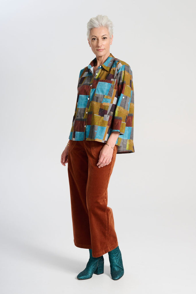 Olga de Polga classic cotton shirt in our AW25 Azure Kismet print from the Odyssey collection. The signature Olga Shirt is great for all occasions. It has an effortlessly chic, relaxed silhouette that drapes with ease. Side front view on model