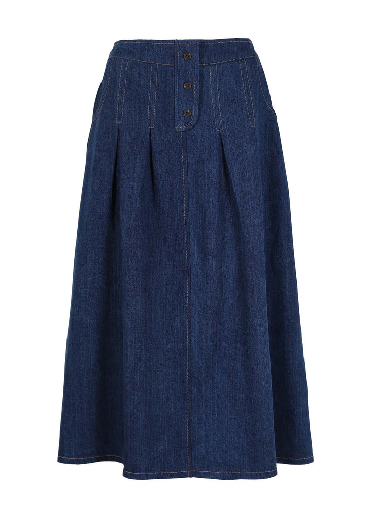 Olga de Polga Monde skirt in original blue denim. is a twist on an everyday denim skirt. Unique and super comfortable. Decorative button detailing at the front. Stitched down tucks coming down from waistband. Front view. 