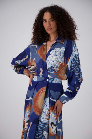 Olga de Polga Parisian dress in the new Festival Blue print. The Parisian Wrap Dress is a chic, versatile shirt dress, with an adjustable, elasticated waistband. Front close up view