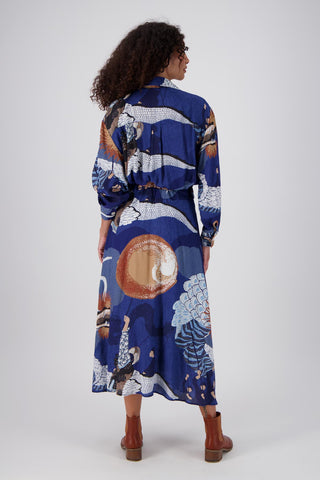 Olga de Polga Parisian dress in the new Festival Blue print. The Parisian Wrap Dress is a chic, versatile shirt dress, with an adjustable, elasticated waistband. Back view