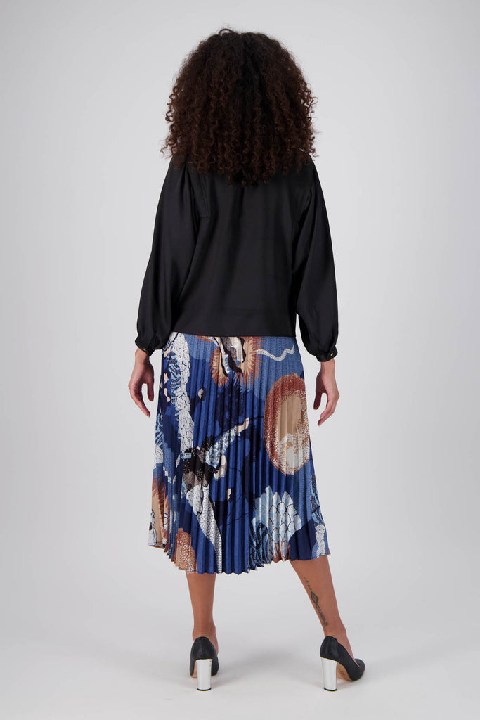 Olga de Polga best selling pleated skirt is back in a new Festival Blue print. Back full length view