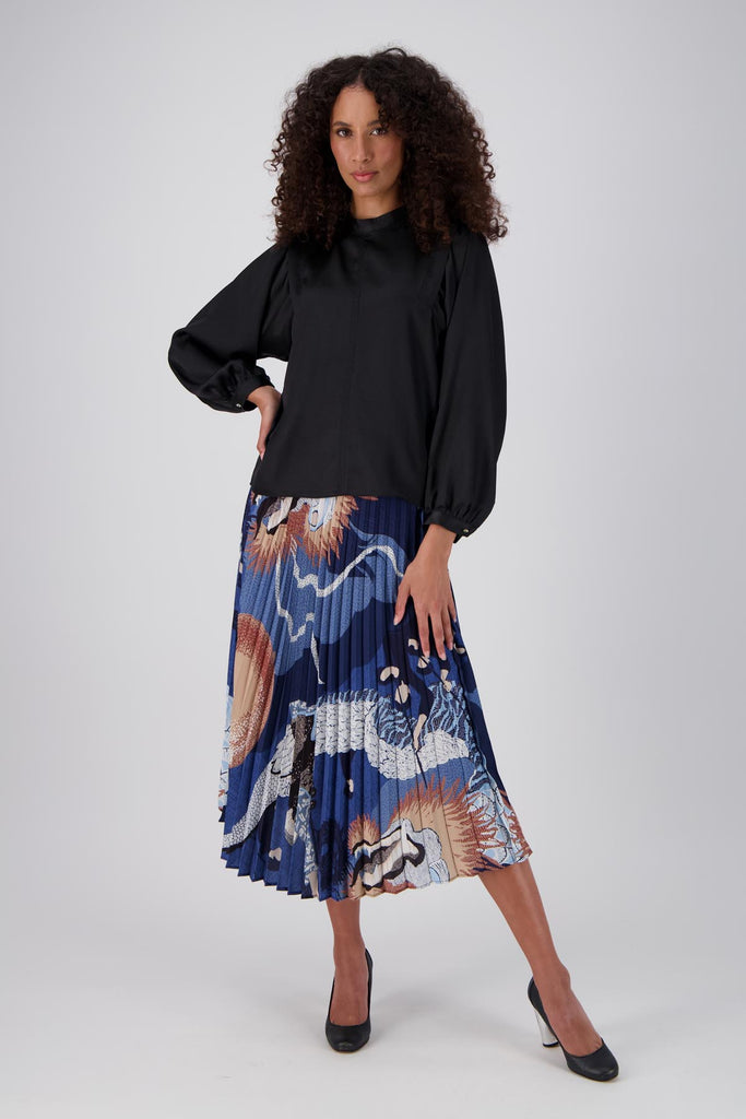 Olga de Polga best selling pleated skirt is back in a new Festival Blue print. Front view on model