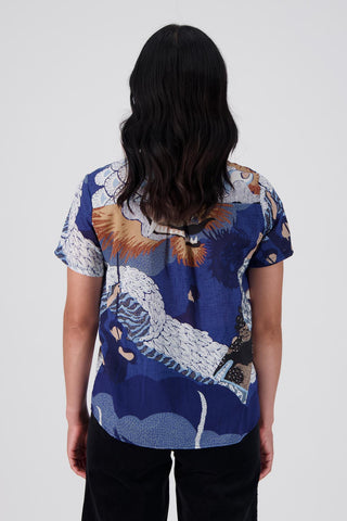 Olga de Polga's best selling print, Festival Blue is back in a new colourway - Blue! The classic top here in 100% cotton voile. Back view on model