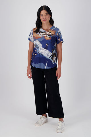 Olga de Polga's best selling print, Festival Blue is back in a new colourway - Blue! The classic top here in 100% cotton voile. Front full length view on model
