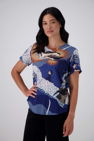 Olga de Polga's best selling print, Festival Blue is back in a new colourway - Blue!  The classic top here in 100% cotton voile. Front close up view on model.