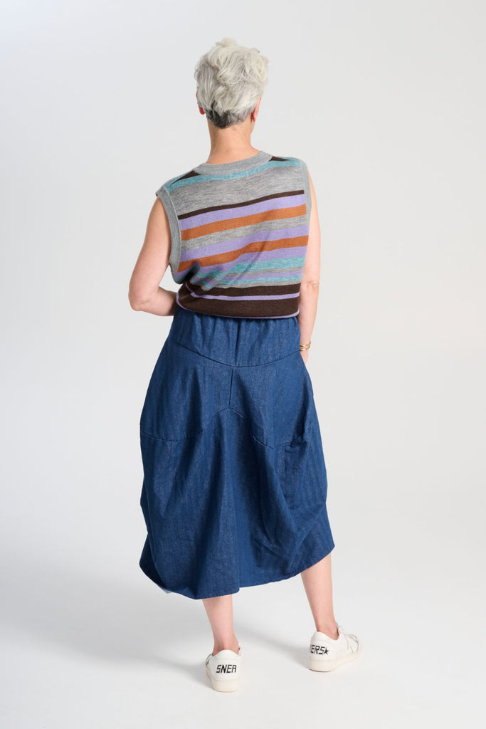 Olga de Polga Milwaukee Harper skirt in mid-wash denim.  Back view on model