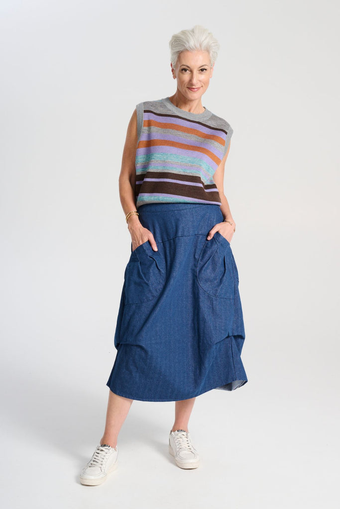 Olga de Polga Milwaukee Harper skirt in mid-wash denim. Front view on model.