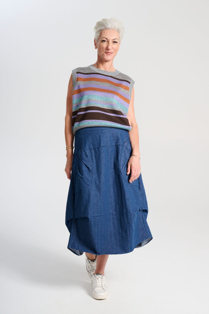 Olga de Polga Milwaukee Harper skirt in mid-wash denim. Front full length view on model
