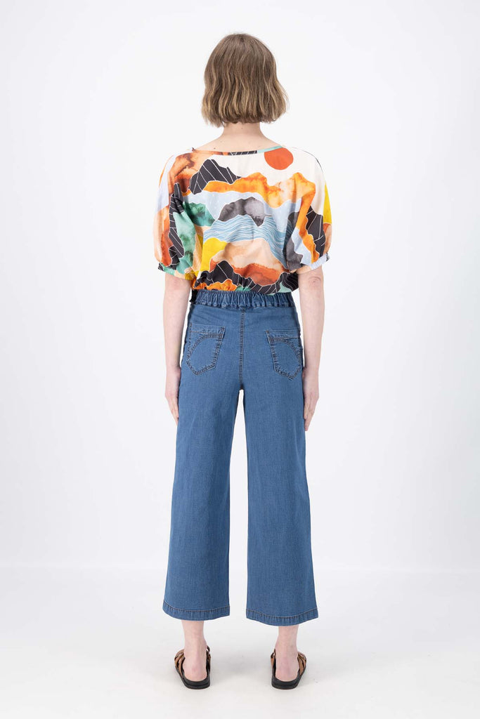 Olga de Polga Peggy Ligera Pants in summer lightweight denim. Light wash. Back full view on model