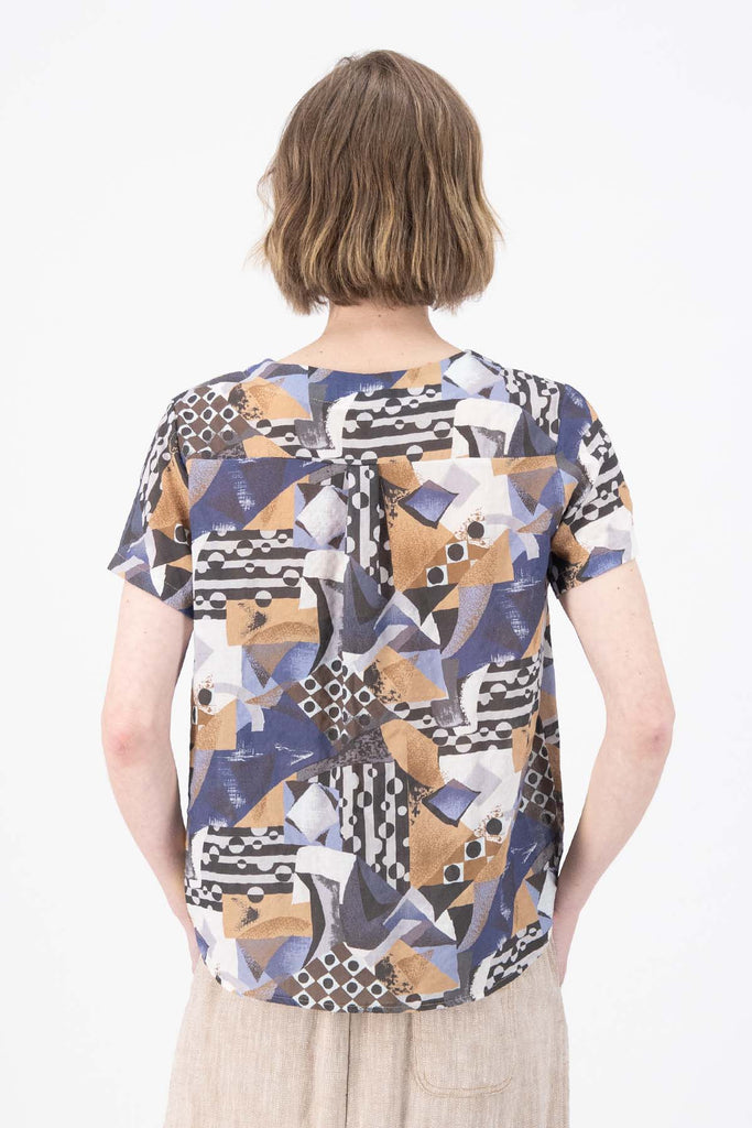 Olga de Polga Blue Mezclar printed cotton seersucker top tee. Round neckline and short sleeves. Finished at the hip. Back close view on model.