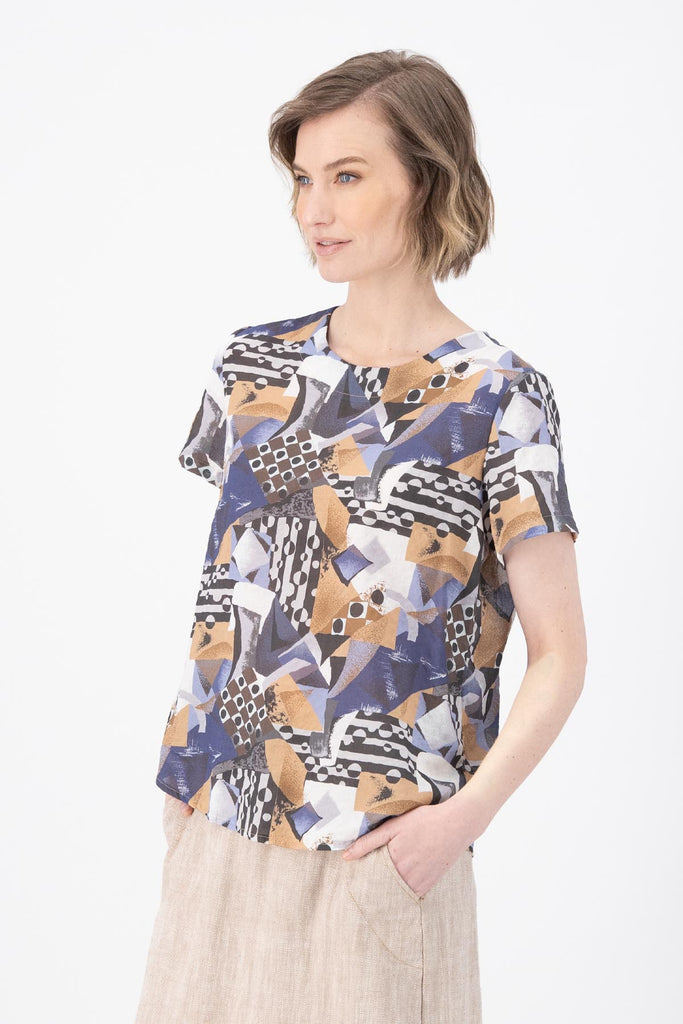 Olga de Polga Blue Mezclar printed cotton seersucker top tee. Round neckline and short sleeves. Finished at the hip. side view on model.
