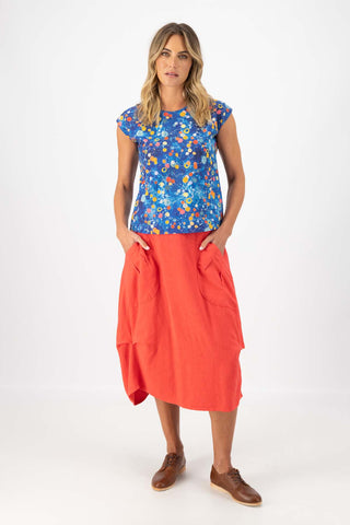 Olga de Polga classic tee top in Blue printed cotton. Print name: Spacio. Blue with accents of red, orange and yellow. Space inspired. Front full length view on model